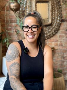 Alessandra de Oliveira smiling inside Laya Spa & Yoga in West Queen West